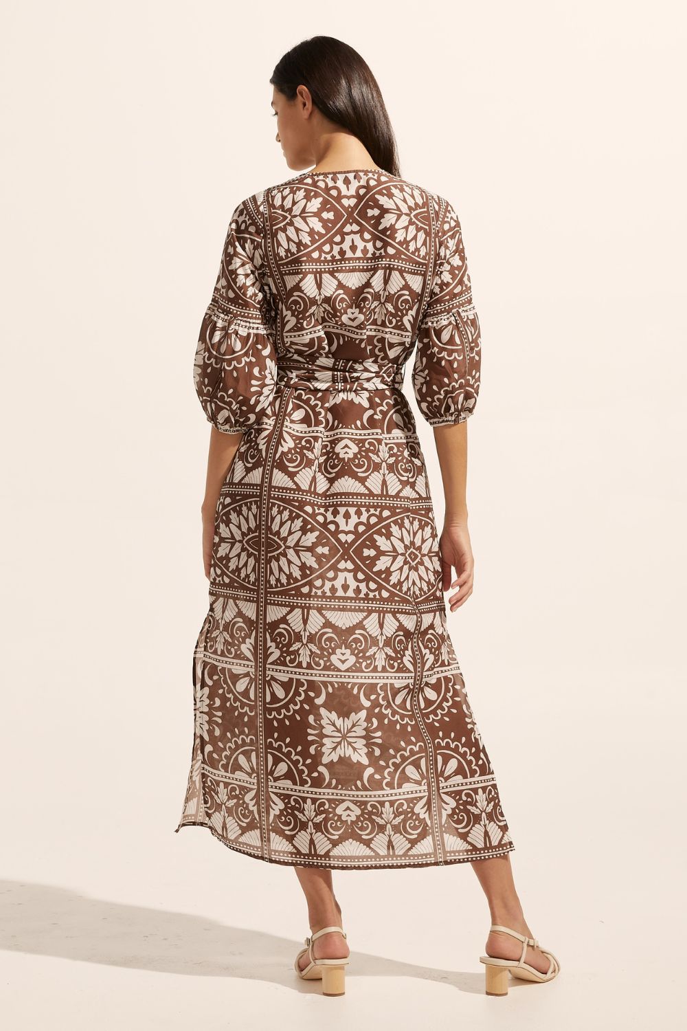 brown and white print, fabric self tie belt, mid length sleeve, rounded neckline, side splits, back view