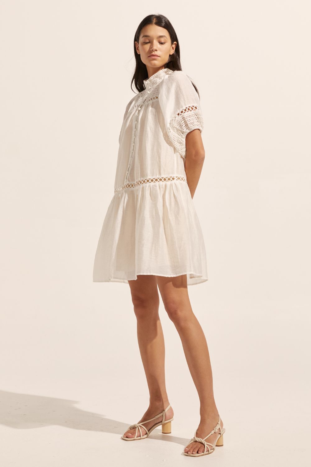 white, high neck, covered buttons, circular lace detailing, drop waist, mid-length sleeve, mini dress, side image