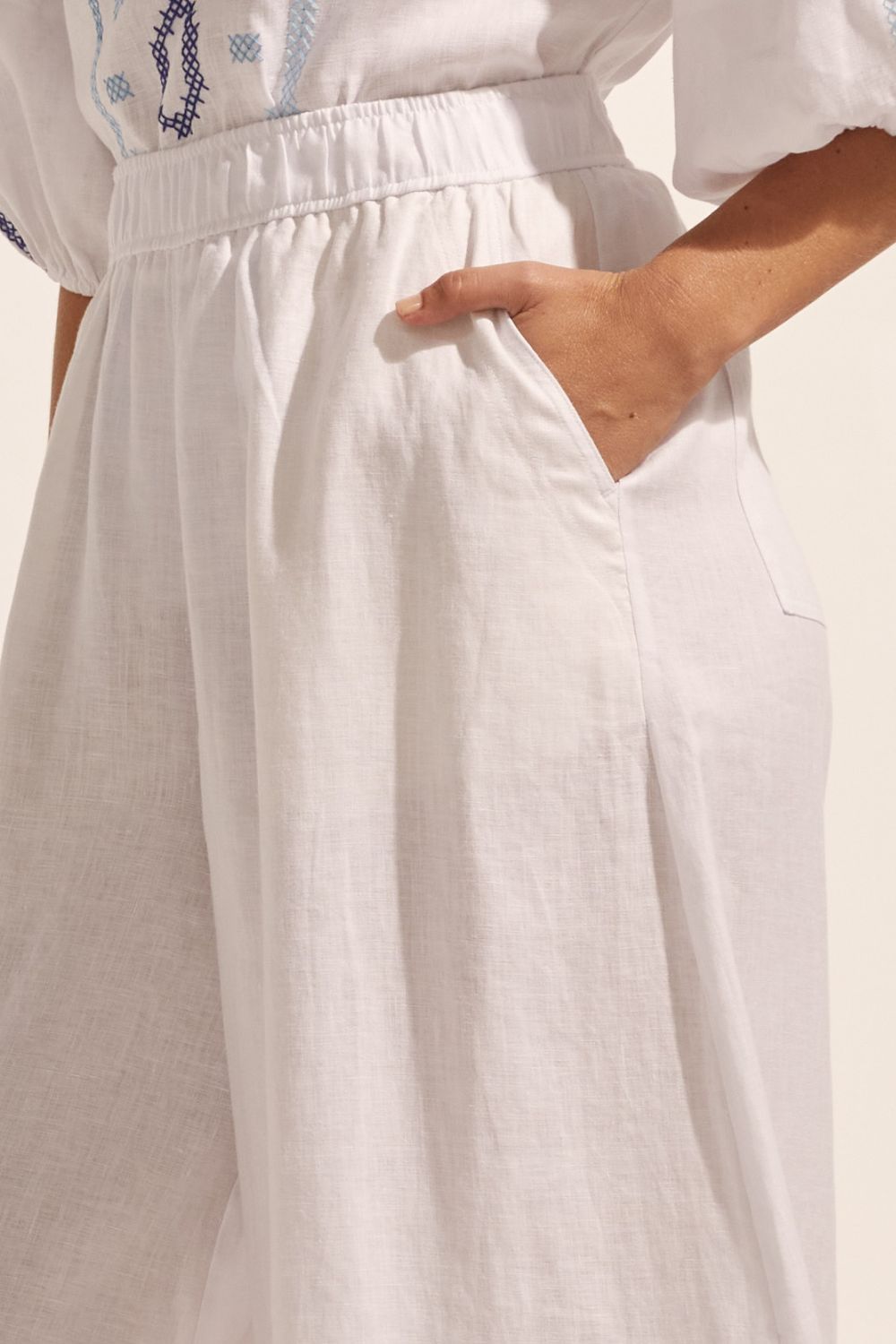 white, pants, elasticated waist, side pockets, wide leg, close up image