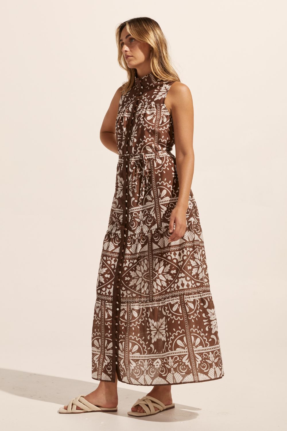 brown and white print, high neck, buttons down centre, thin fabric belt, sleeveless, dress, side view