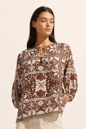 brown and white print, rounded neckline, mid length sleeve, front view