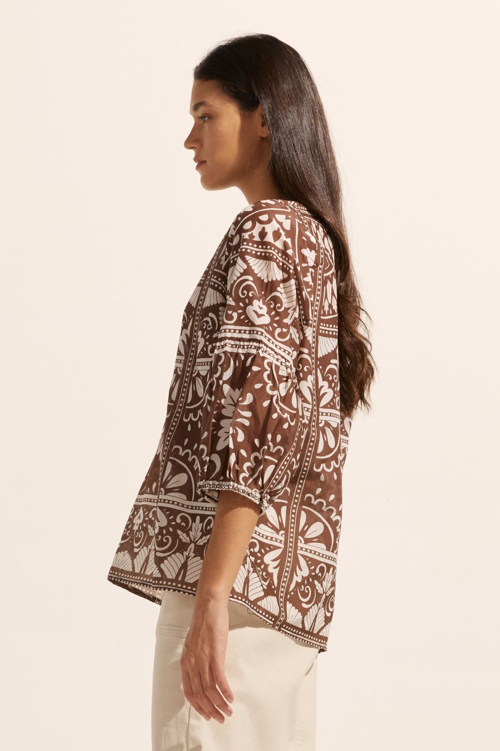 brown and white print, rounded neckline, mid length sleeve, side view