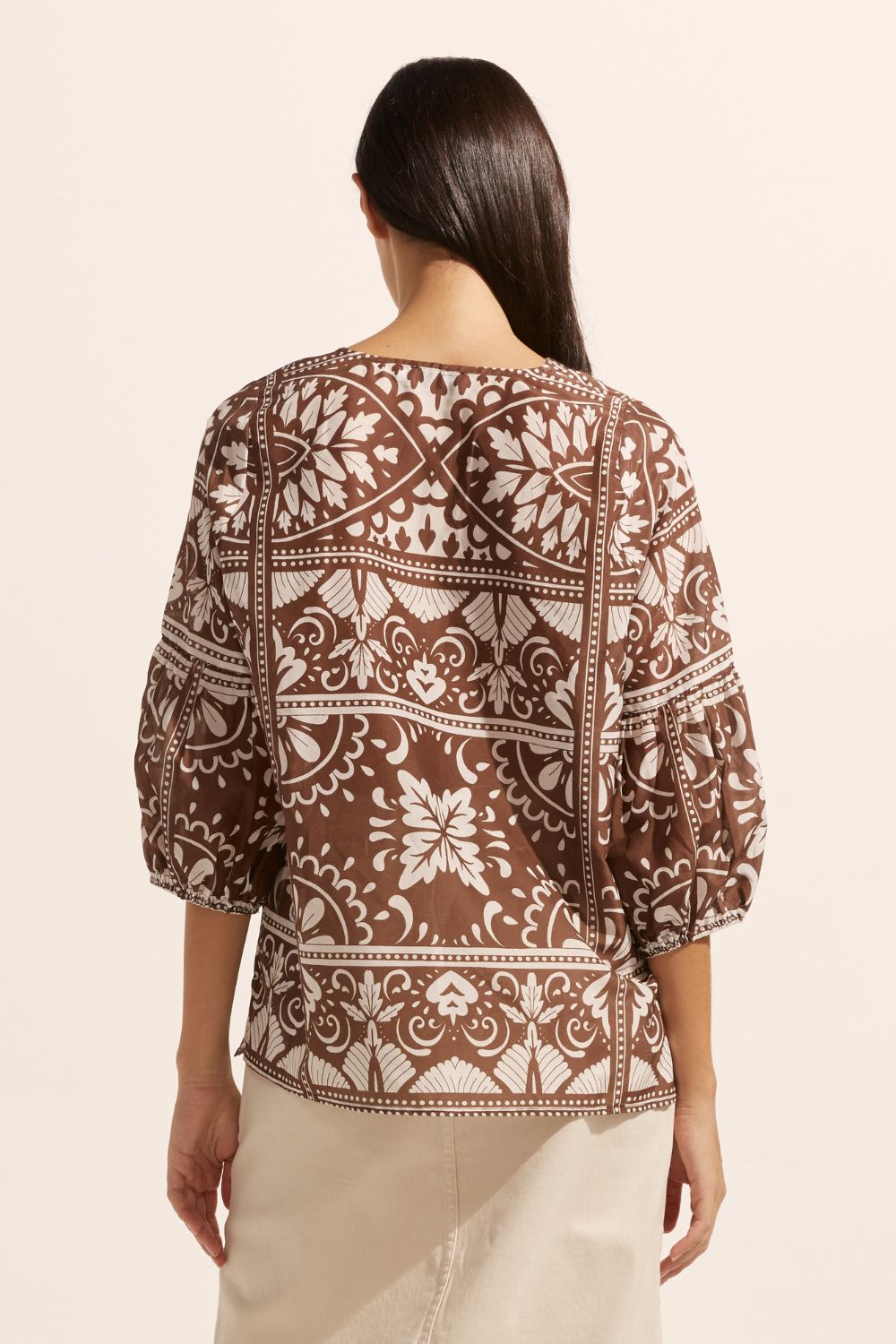 brown and white print, rounded neckline, mid length sleeve, back view