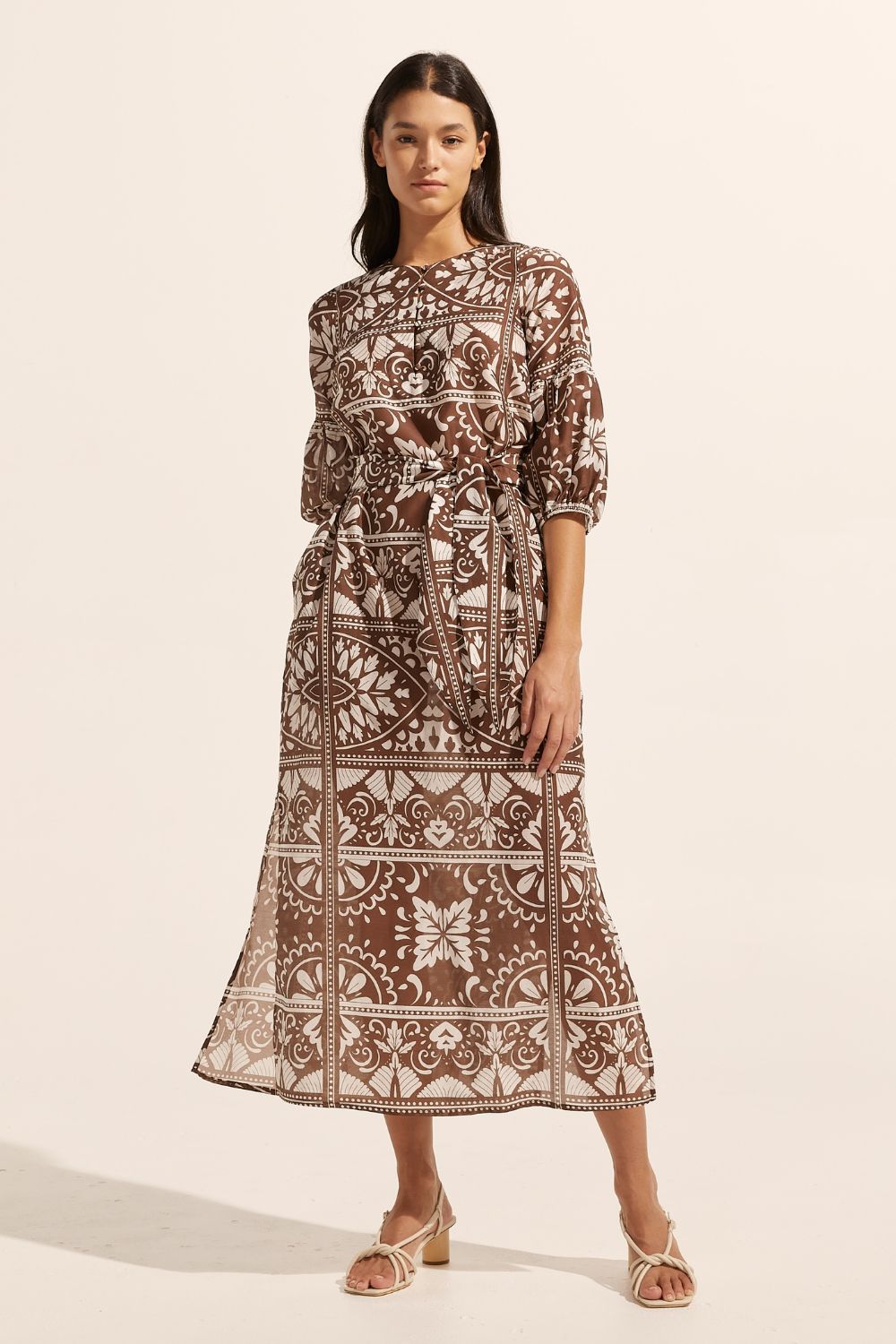 brown and white print, fabric self tie belt, mid length sleeve, rounded neckline, side splits, front view
