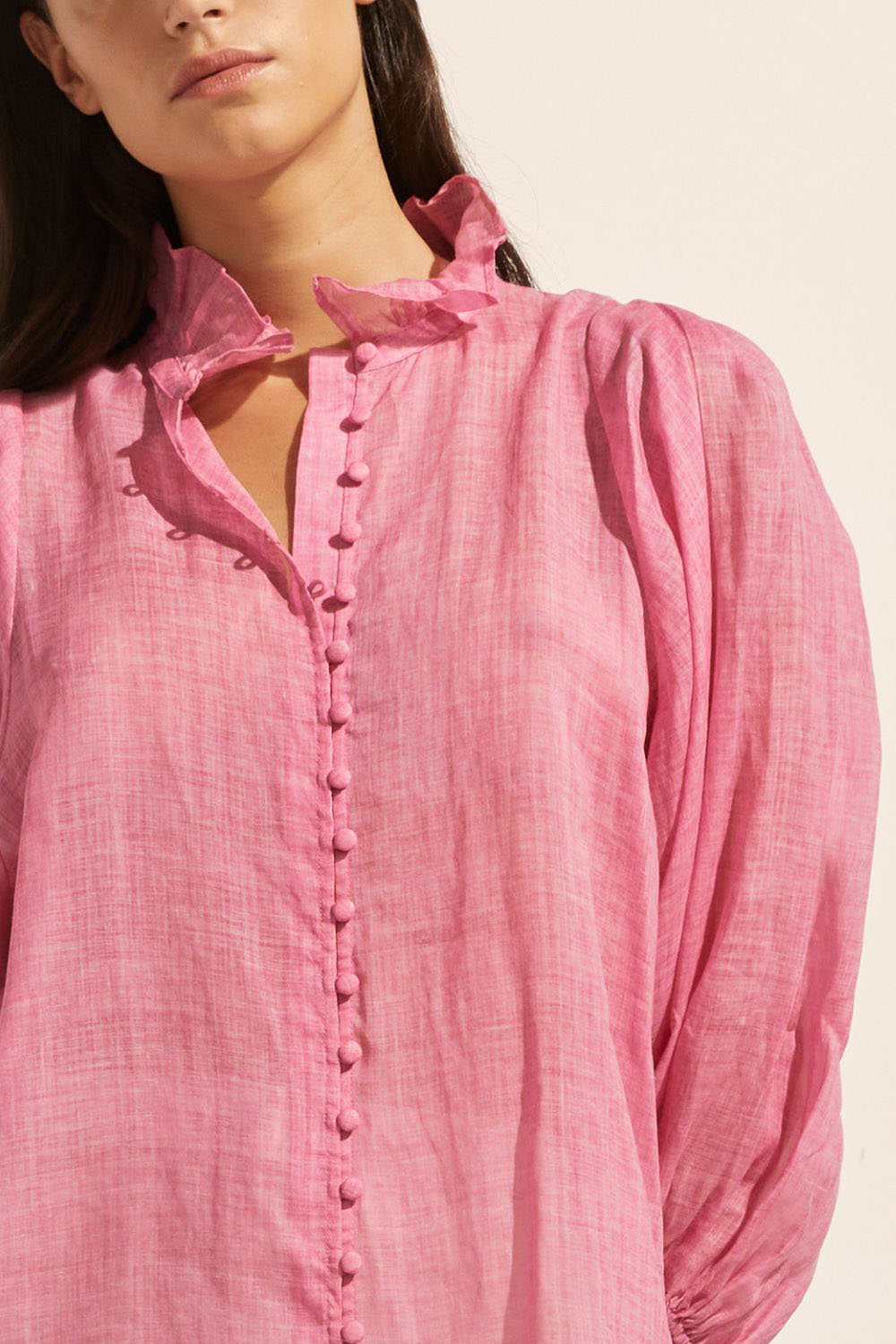 pink, covered buttons, voluminous sleeve, high neck, ruffle collar, mid length sleeve, elasticated cuff, top, close up image