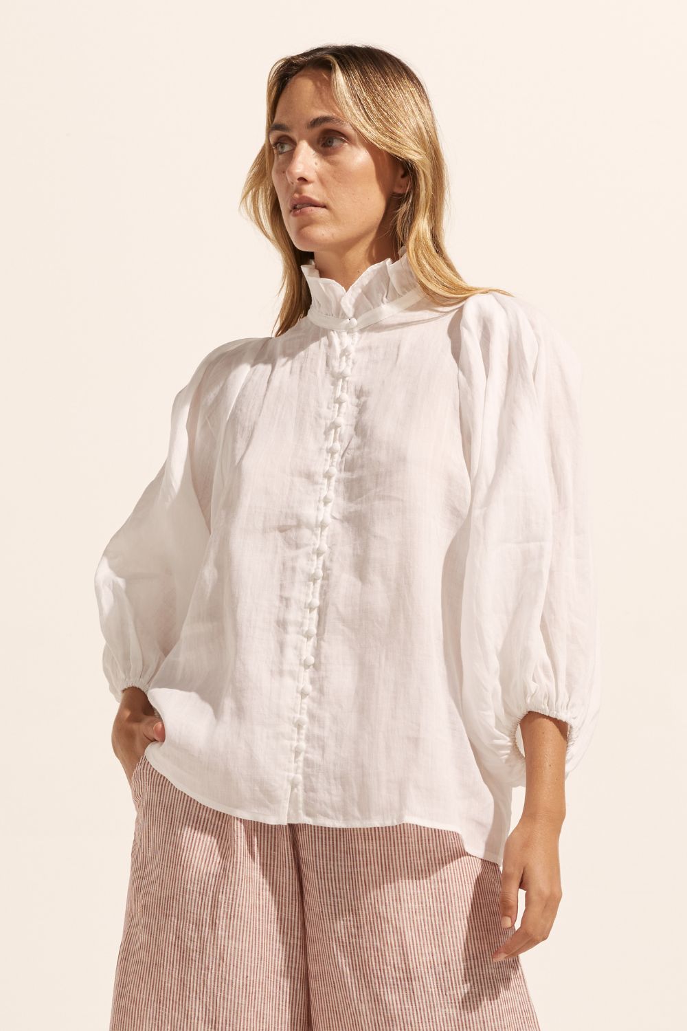 white, ruffle neck collar, buttons down centre, mid length sleeve, shirt, front view