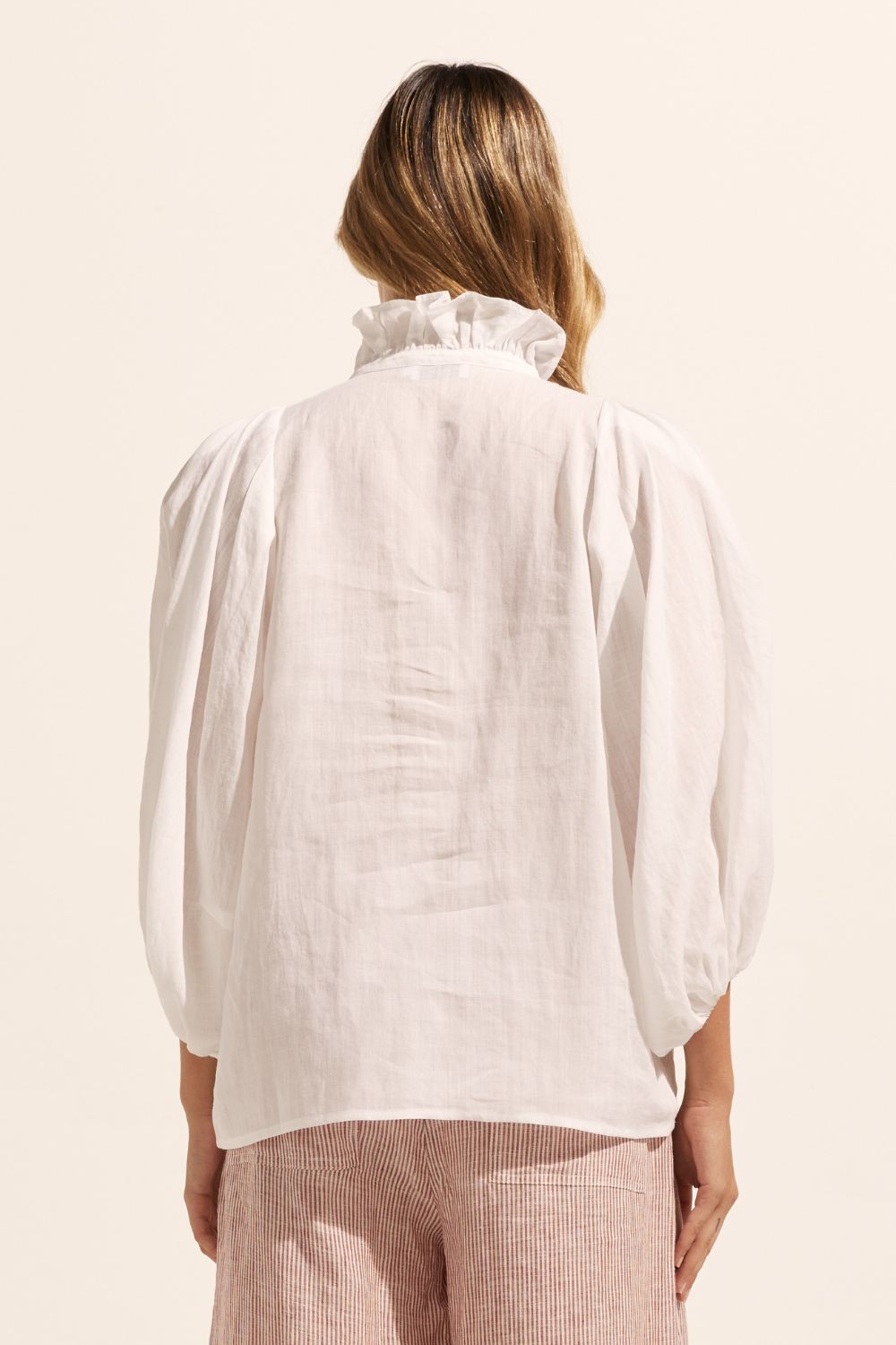 white, ruffle neck collar, buttons down centre, mid length sleeve, shirt, back view