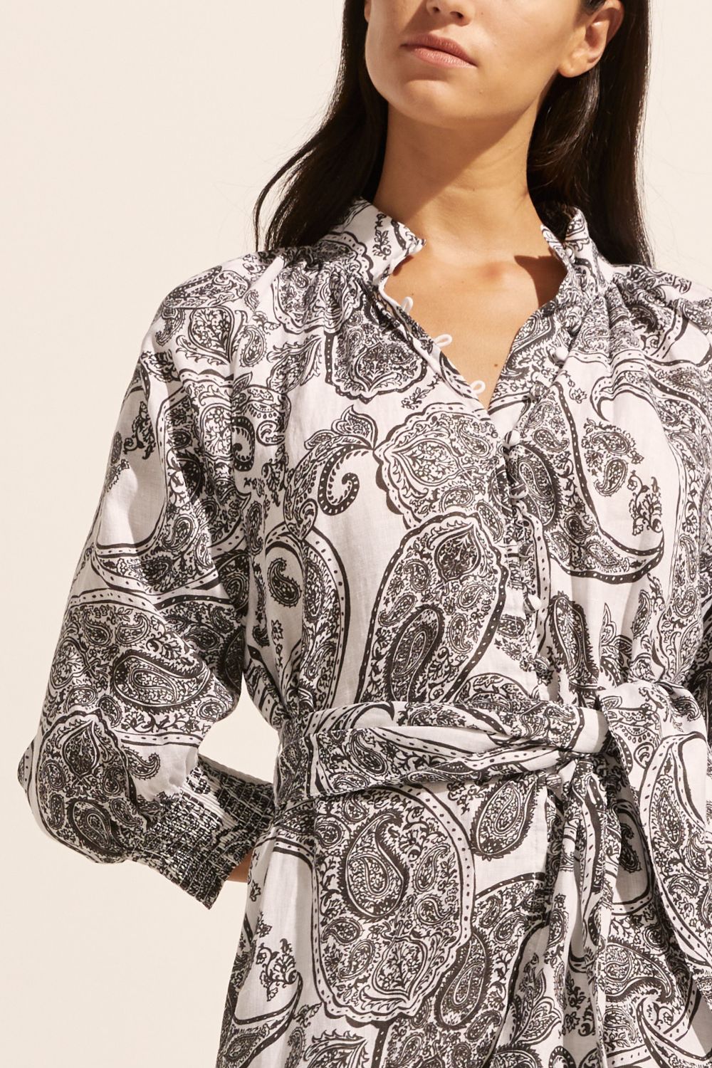 black and white print, self tie fabric belt, high neck, mid length sleeve, midi dress, side pockets, close up view