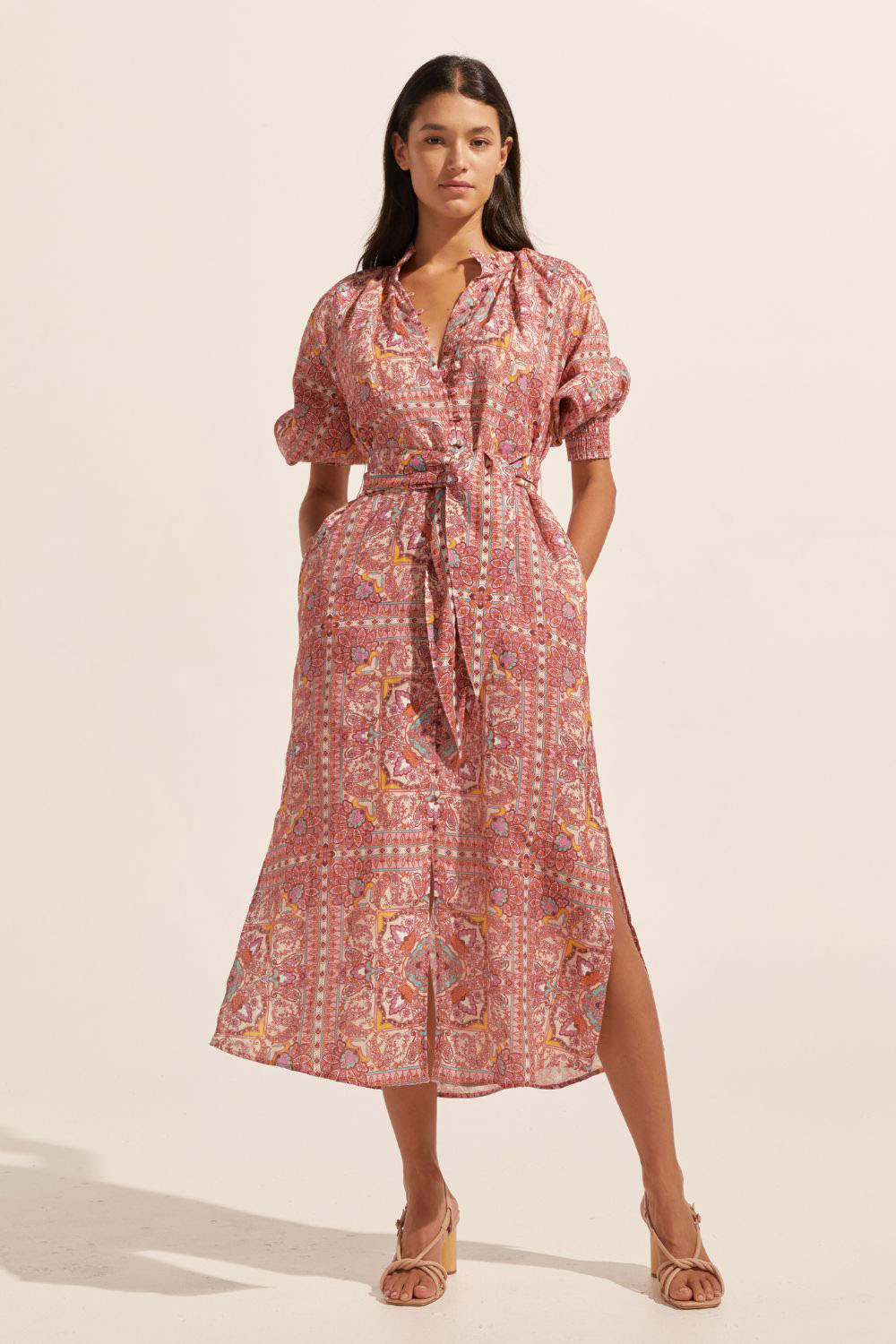 pink print, high neck, covered buttons down centre, self tie fabric belt, elasticated sleeve cuff, mid length sleeve, side splits, midi dress, front image