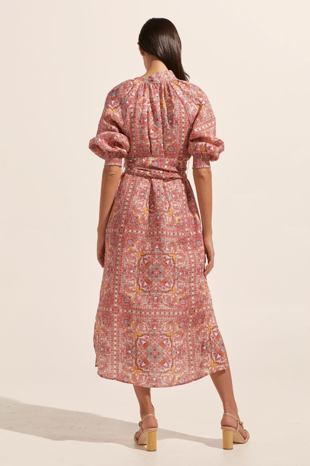 pink print, high neck, covered buttons down centre, self tie fabric belt, elasticated sleeve cuff, mid length sleeve, side splits, midi dress, back image