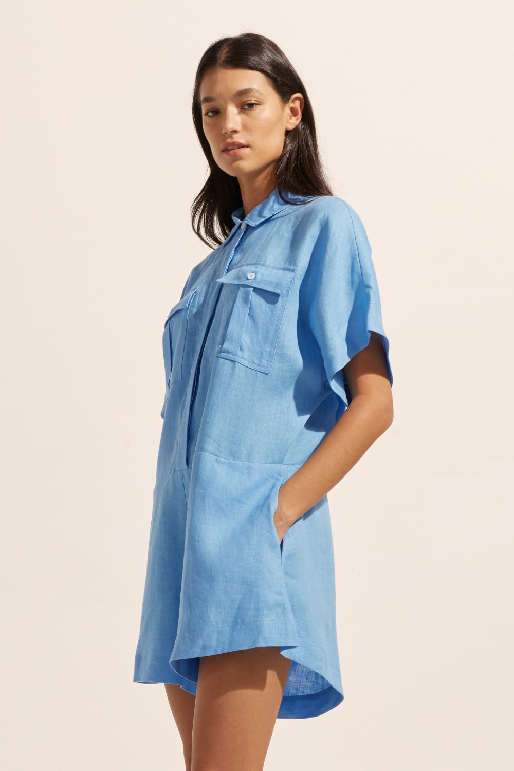 blue, jumpsuit, button down collar, oversized patch pockets, side view
