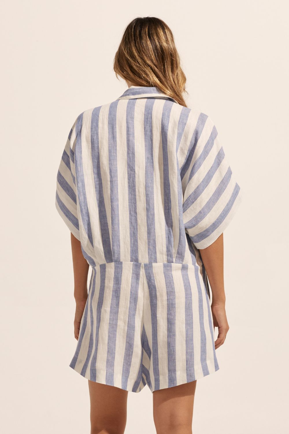 blue and white stripe, jumpsuit, button down collar, oversized patch pockets, back view