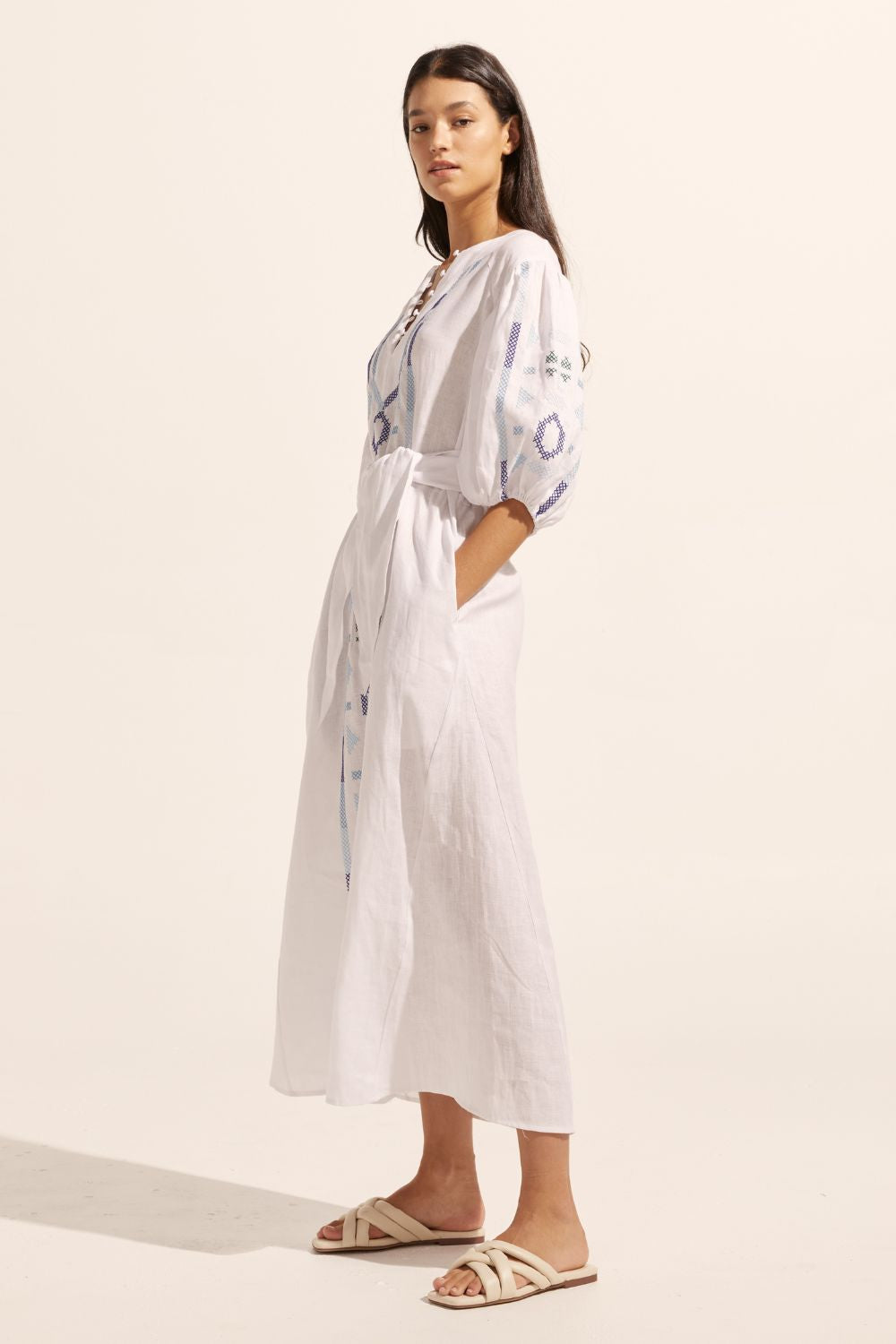 white and blue, maxi dress, embroidery, mid length sleeve, self tie fabric belt, side view image
