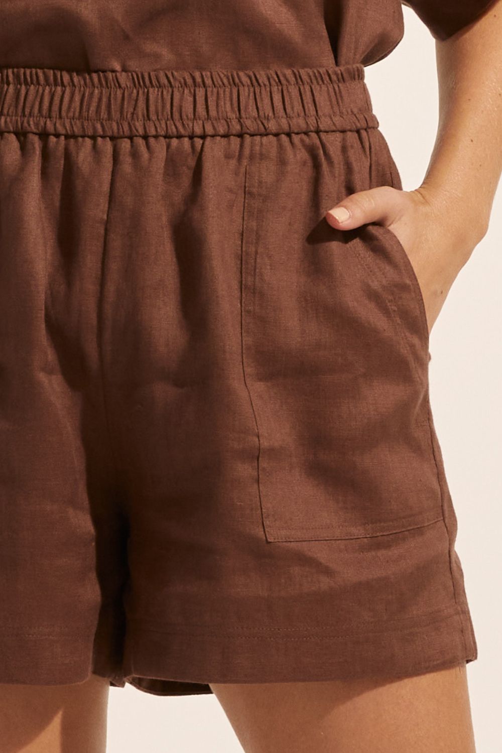 brown, shorts, elasticated waist, side pockets, close up image
