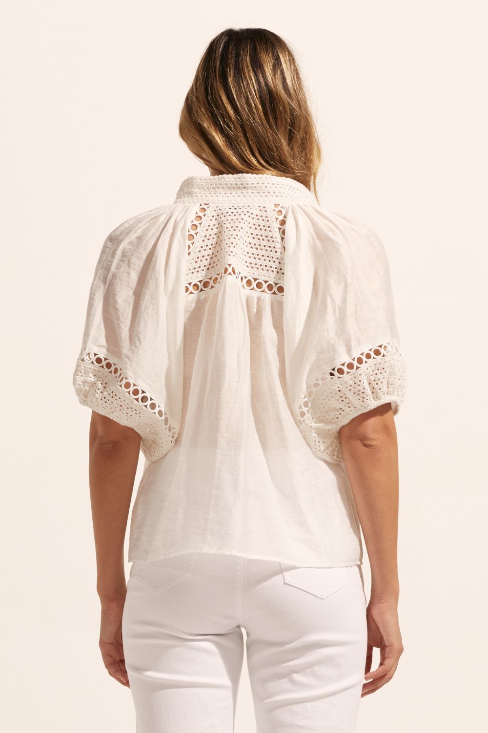white, top, high neck, mid-length sleeve, covered buttons, circular lace detailing, back image