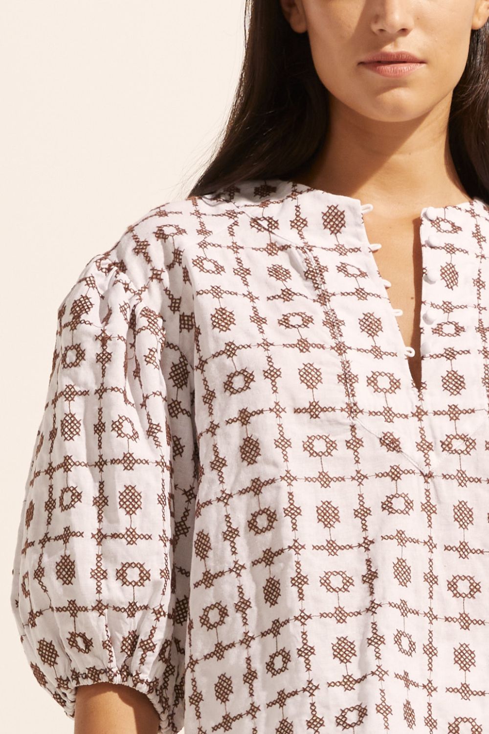 brown and white, top, mid length sleeve, button down neckline, embroidered, close up image