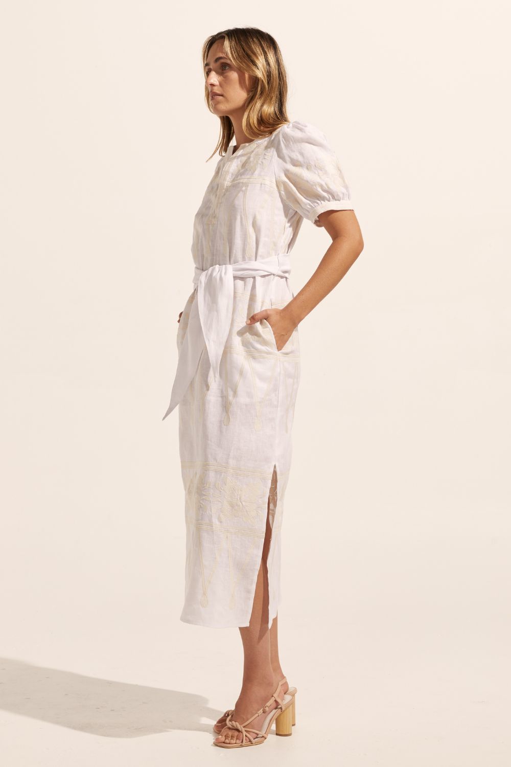 white and cream, midi dress, fabric self tie belt, mid length sleeve, embroidered,  rounded neckline, side splits, side pockets, side image