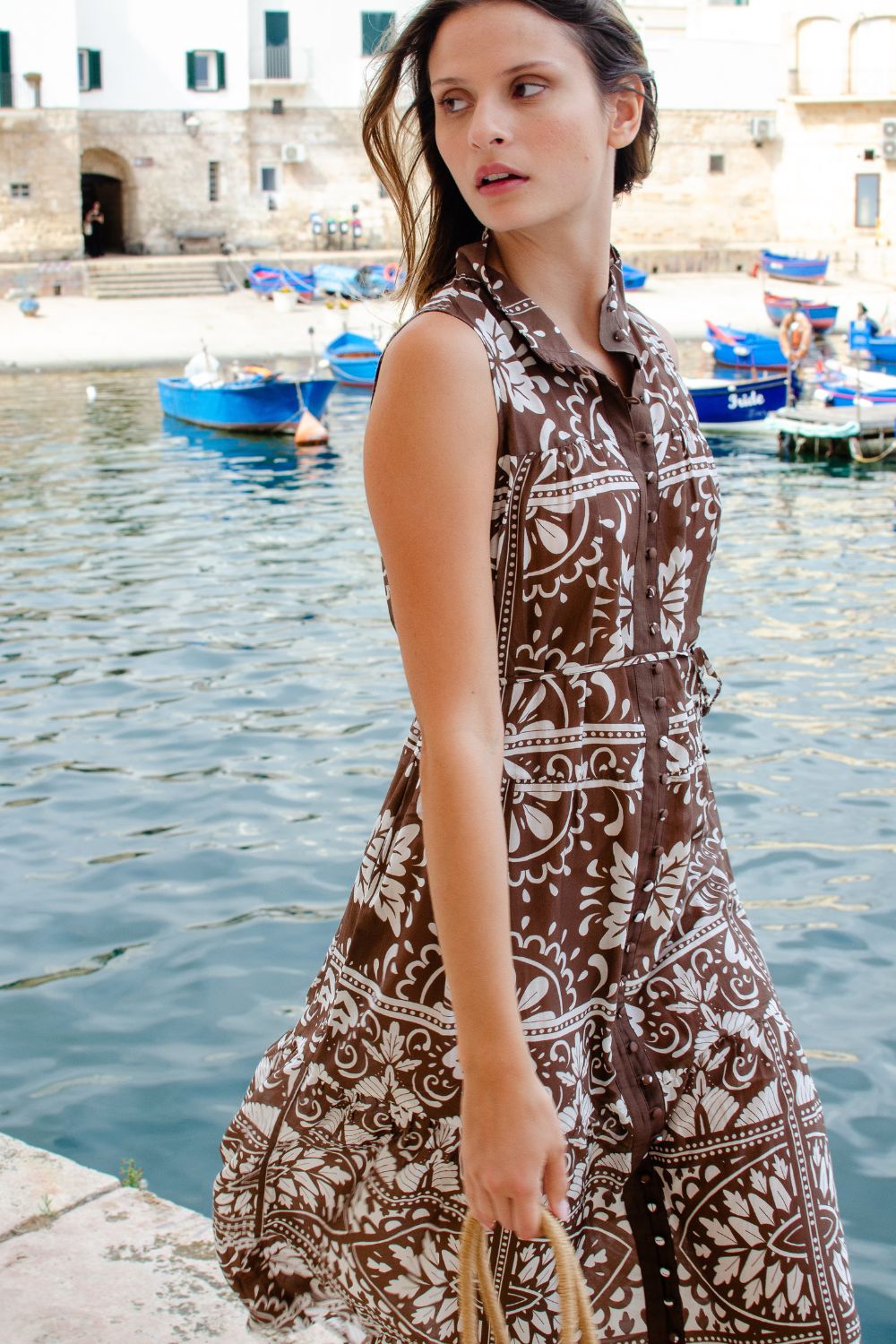 brown and white print, high neck, buttons down centre, thin fabric belt, sleeveless, dress, campaign image