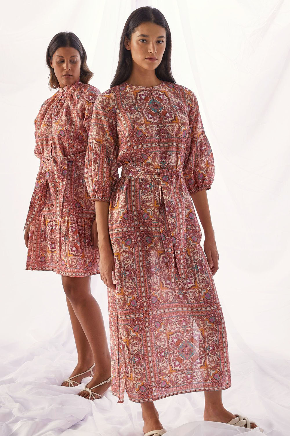 pink print, side splits, maxi dress, self tie fabric belt, rounded neckline, mid length sleeve, campaign image
