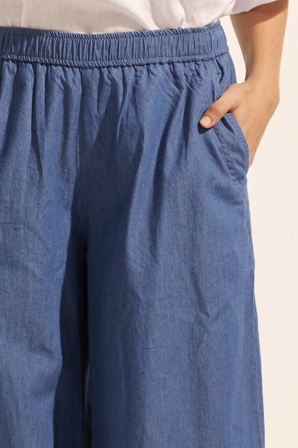 blue, pants, elasticated waist, side pockets, wide leg, close up image