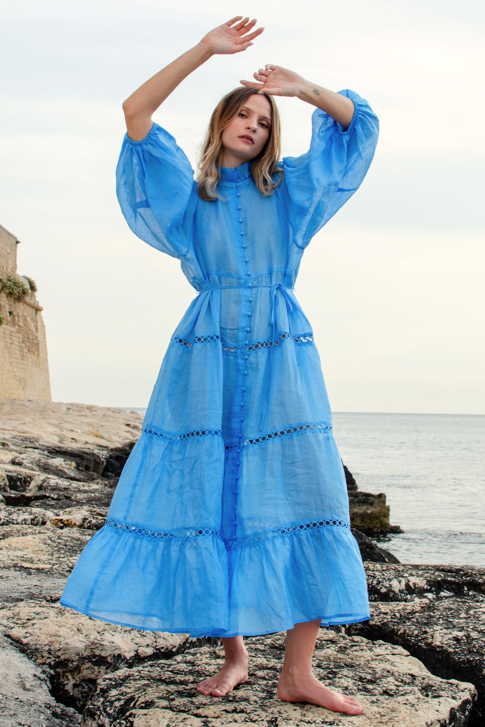 blue, dress, buttons through centre, ruffle collar, mid length sleeve, self tie fabric belt, midi dress, tiered skirt, campaign image